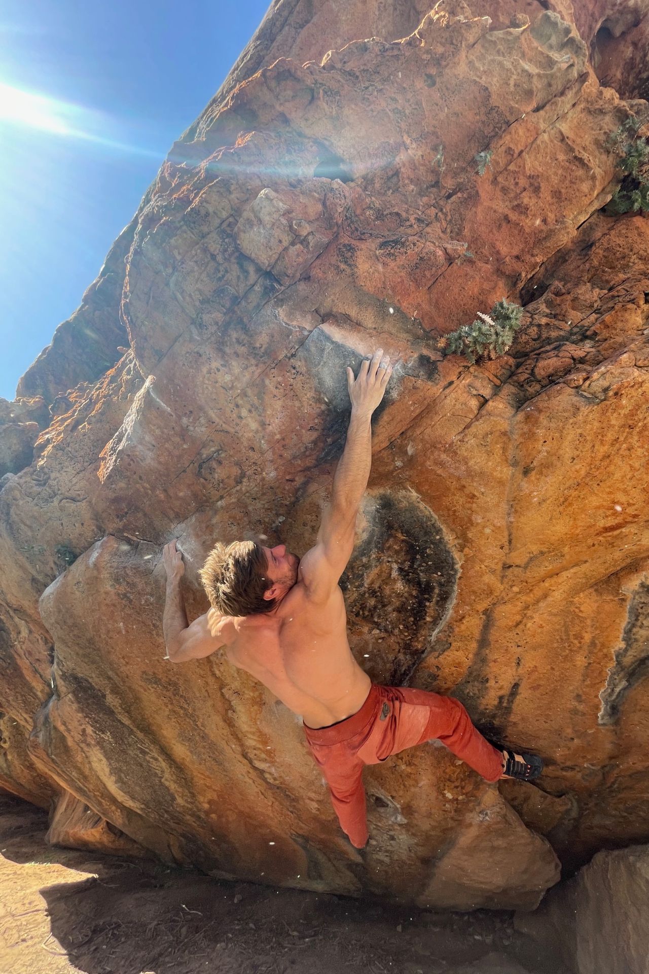 Michael Hauss bouldering in the sun outside
