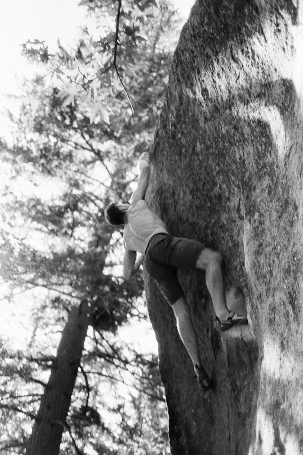Black and white photo of Michael bouldering