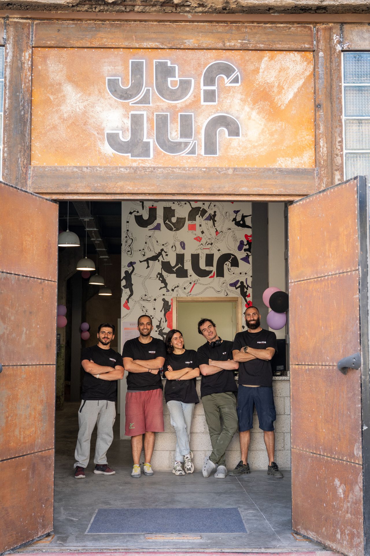 Members of the Ver Var team posing at the gym's entrance