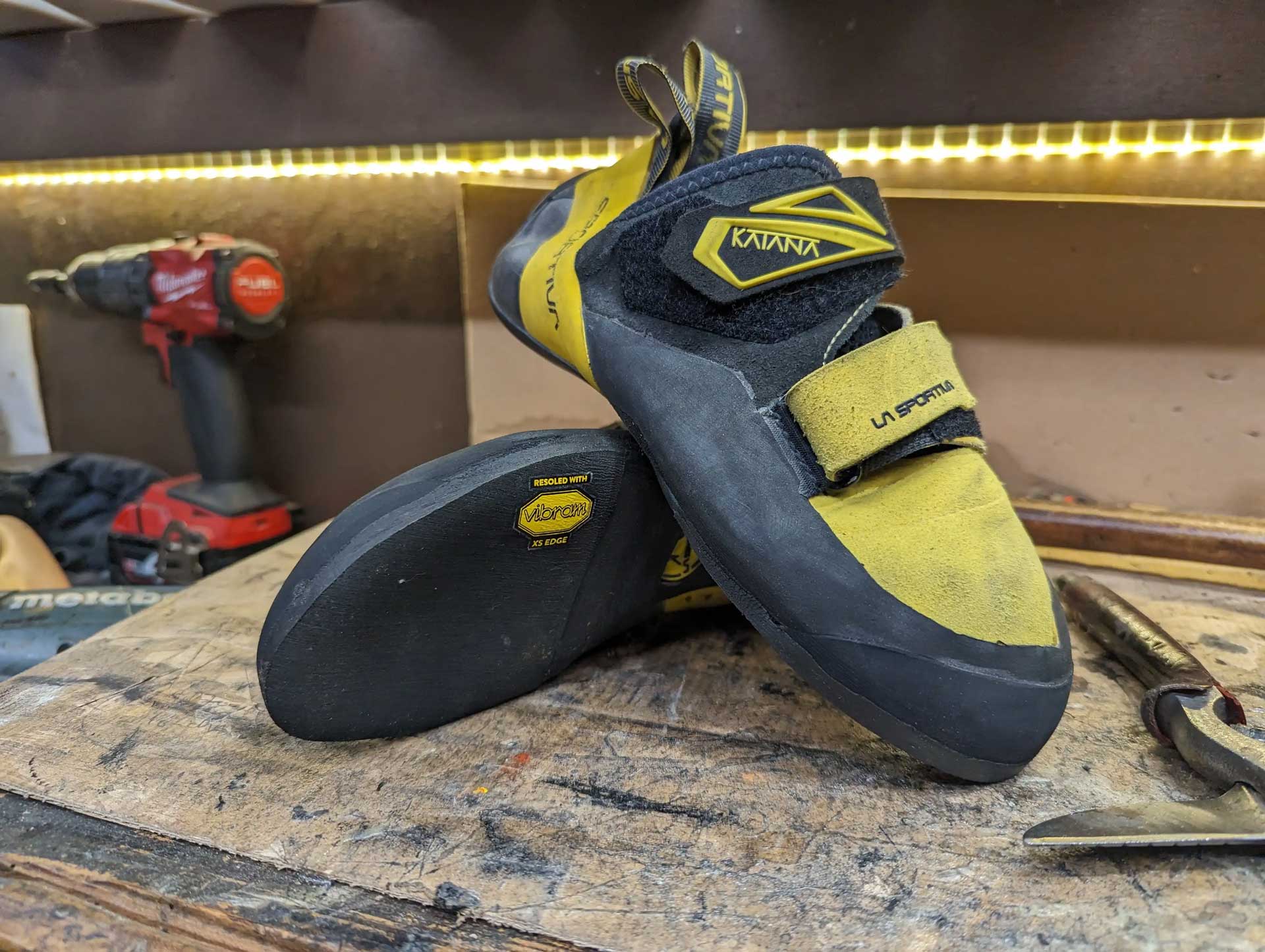 Finished product of a pair climbing shoes that has been repaired