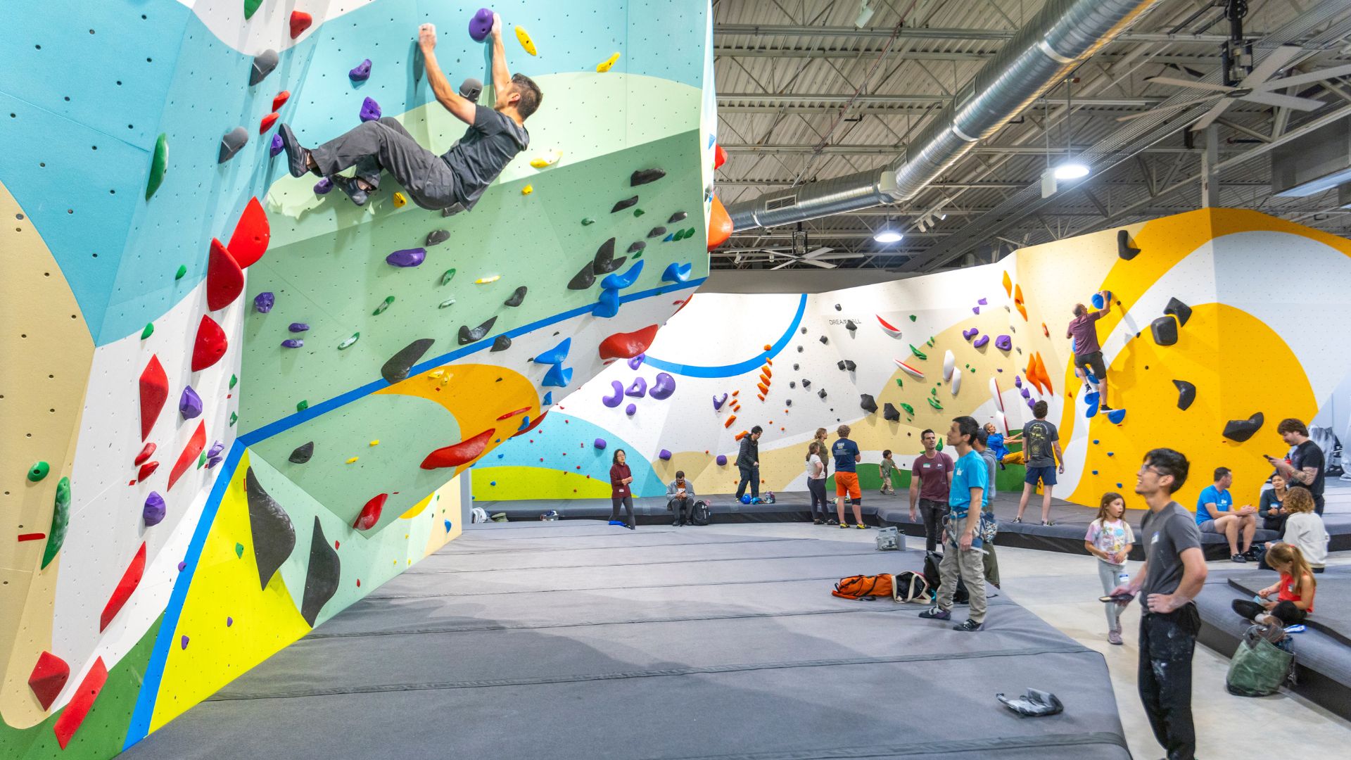 Climbers bouldering at the new Aliso Viejo gym
