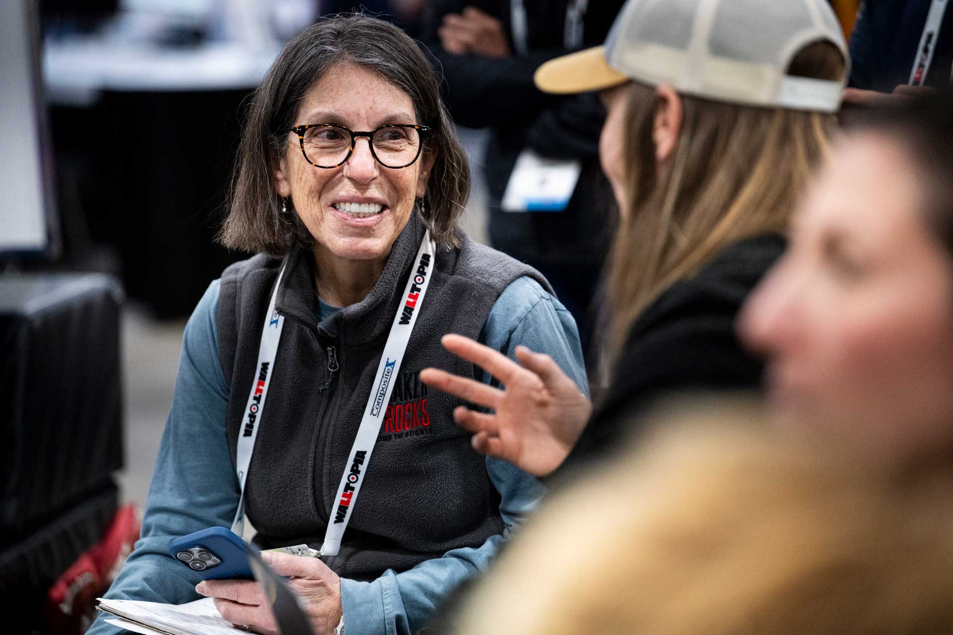 CWA Summit attendees chatting at a Community Hub last year