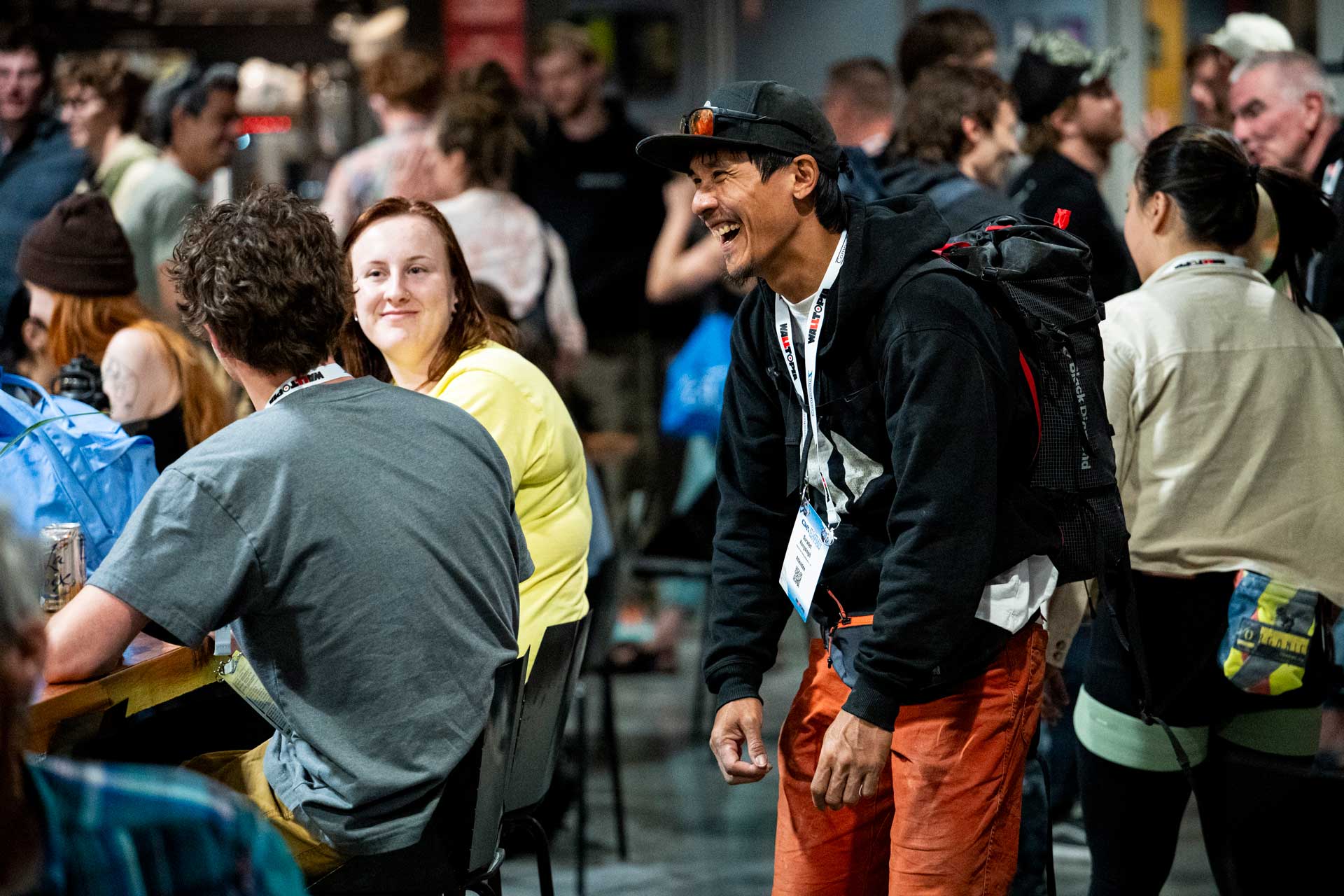 Attendees laughing at an after party last year