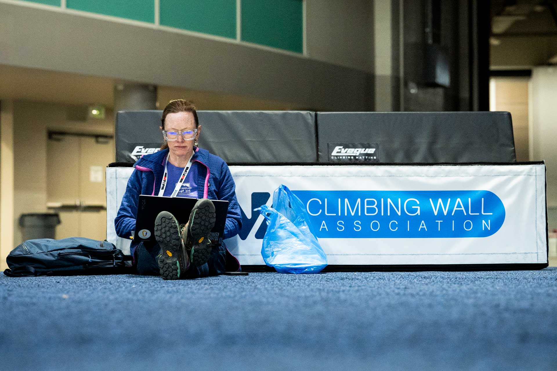 A CWA Summit 2025 attendee sitting with a laptop