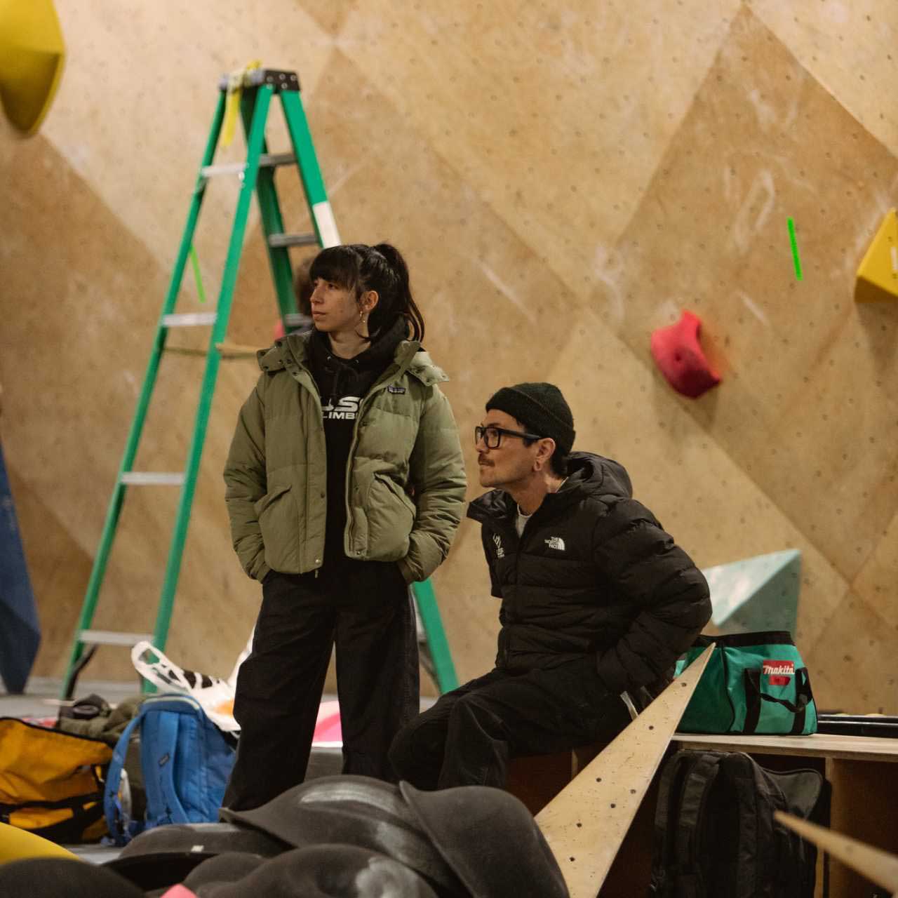 Jeremy sitting next to a fellow setter during a setting session