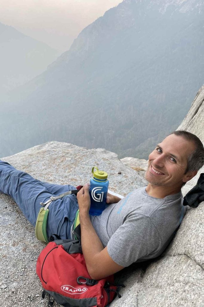 Jason relaxing on a big wall ledge