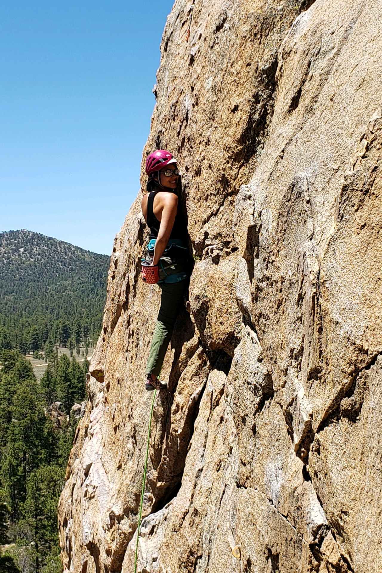 Alice lead climbing outdoors