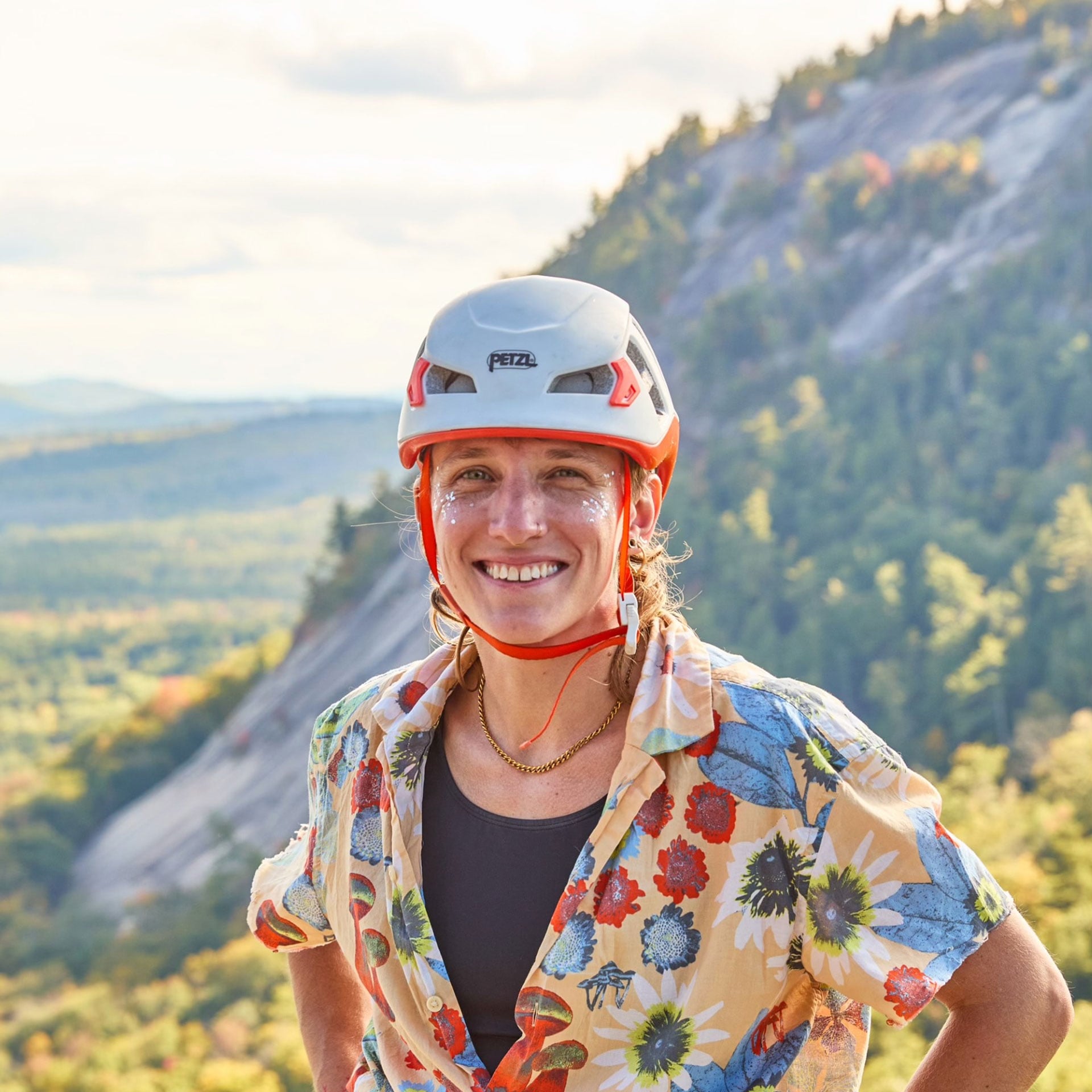Hann Smiley outdoors with a climbing helmet on