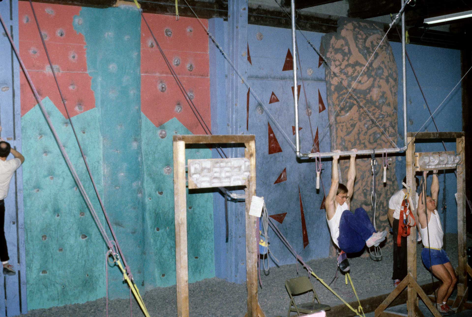 Climbers using a hangboard and training area at Vertical Club, back in 1990