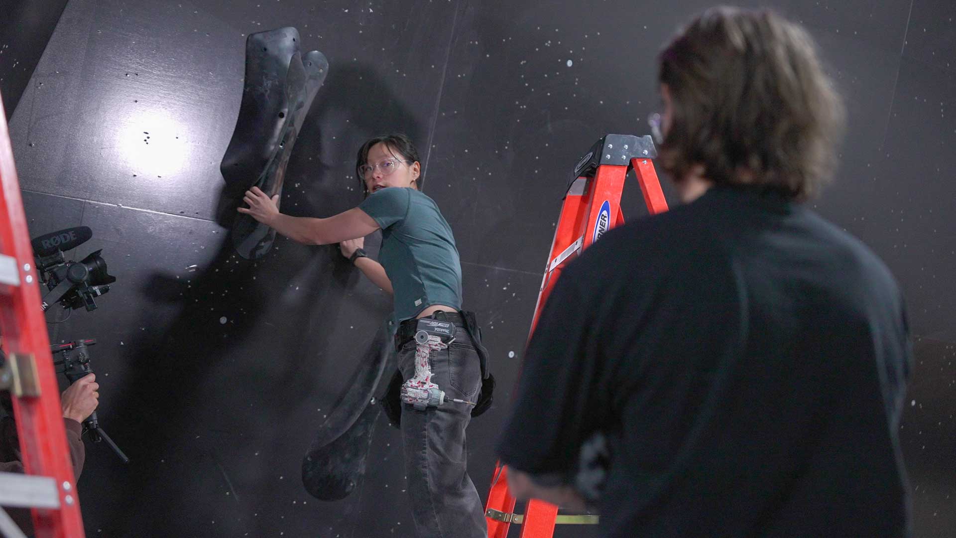 Ruth Jang setting a bouldering problem with a fellow routesetter at the TTC