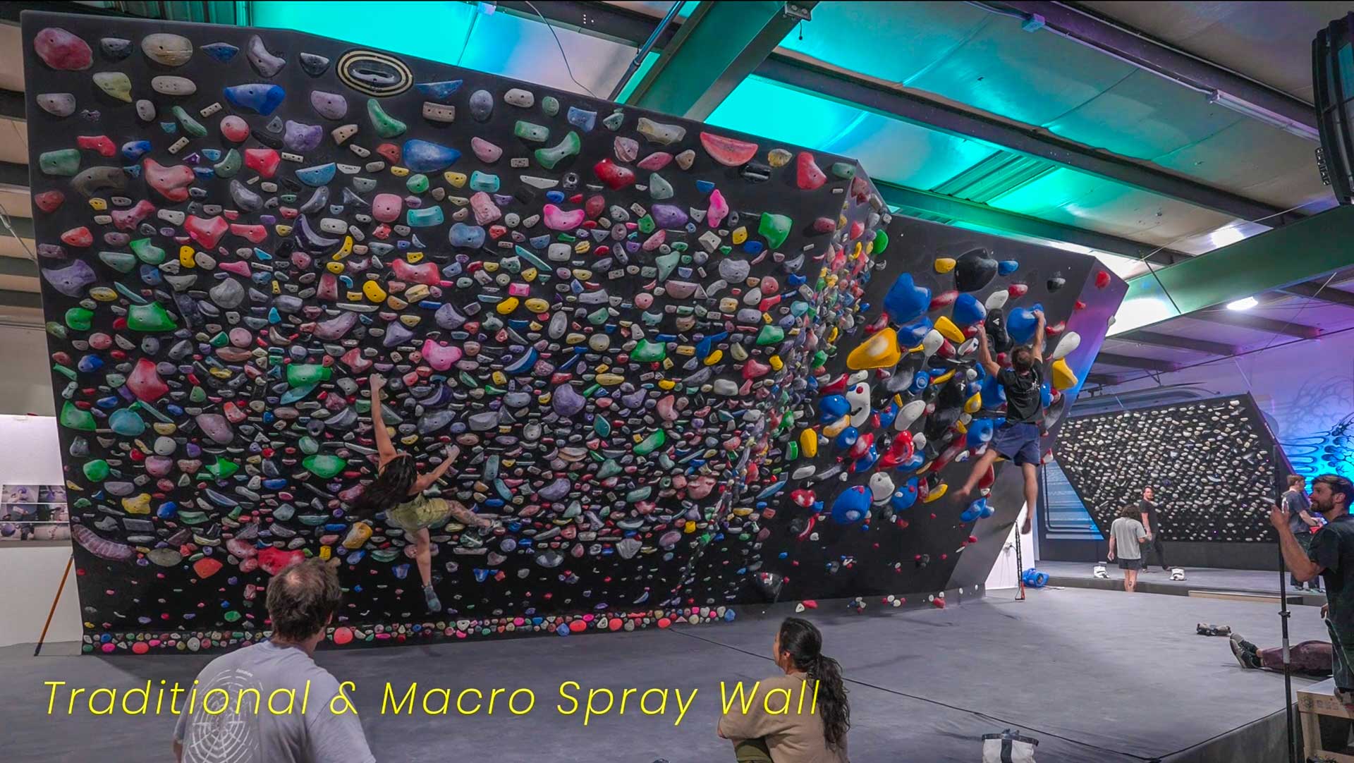 Athletes climbing a spray wall at the TTC