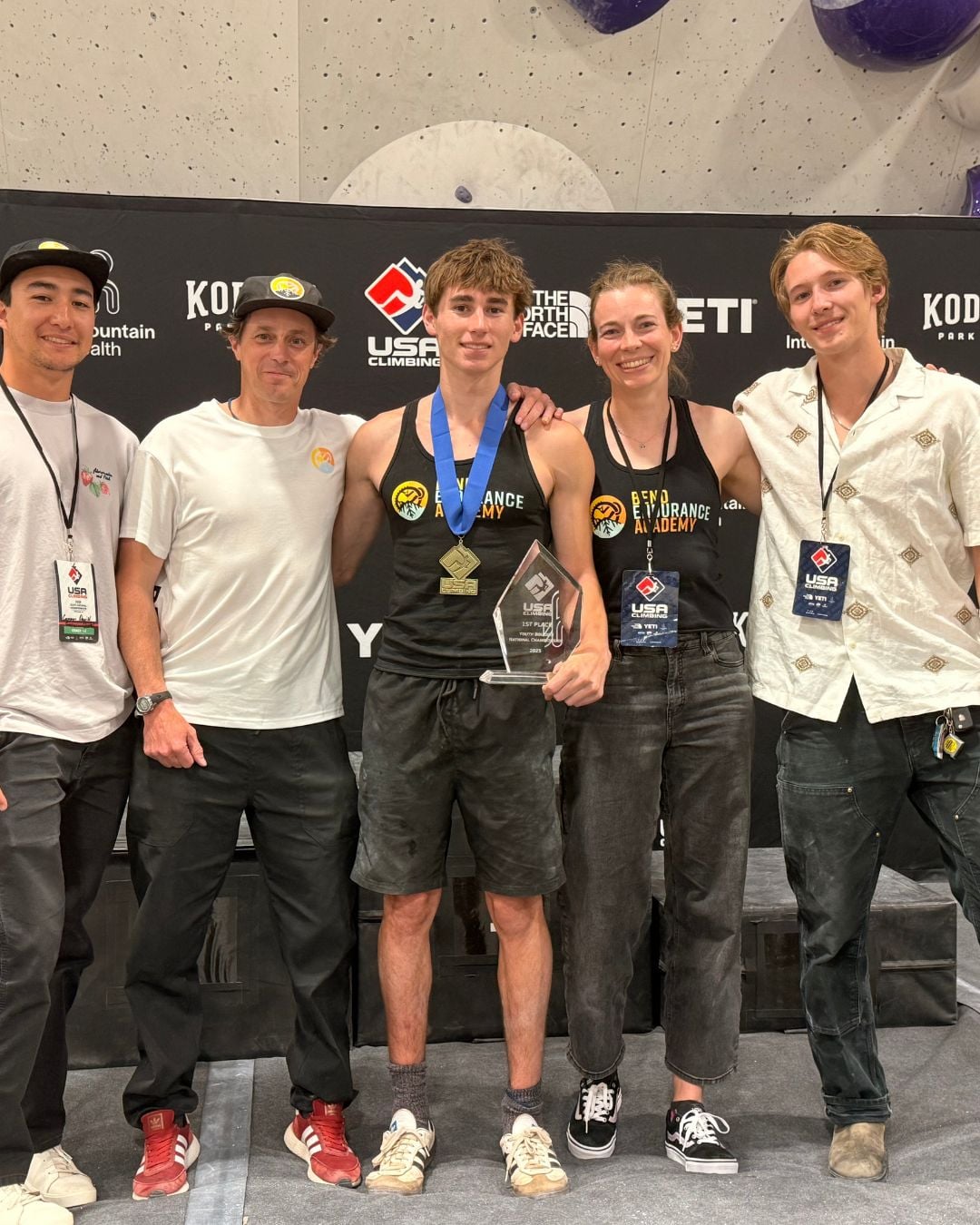 Cate standing in a post-comp team photo