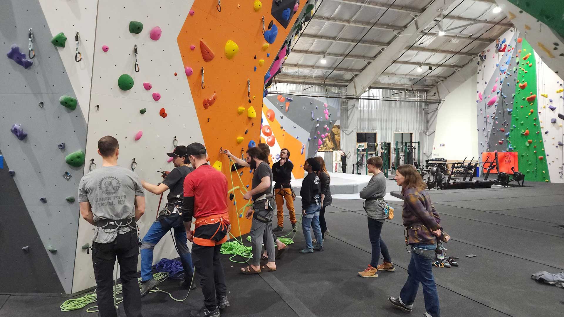 Instructors leading an intro to lead climbing class