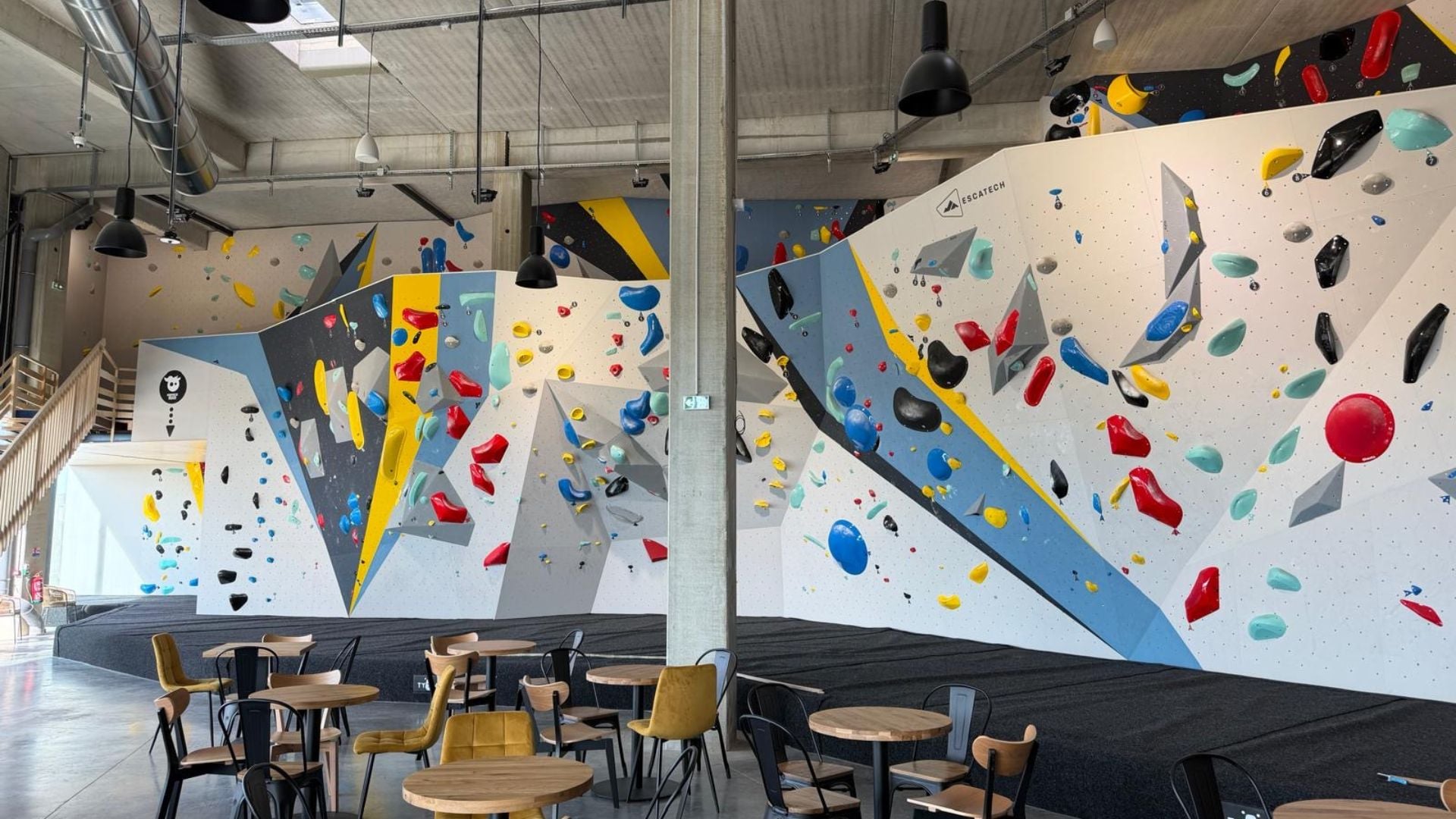 The bouldering wall on the new gym's ground floor