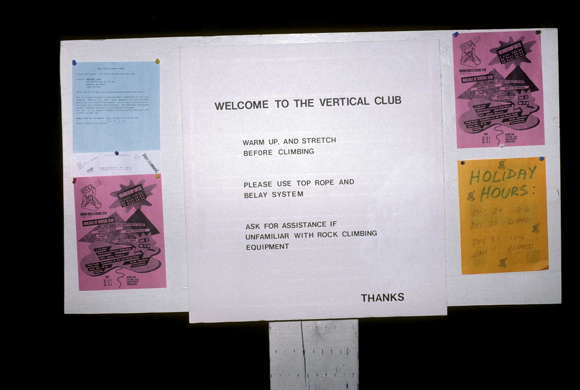 A "welcome to the Vertical Club" sign from the gym's early days