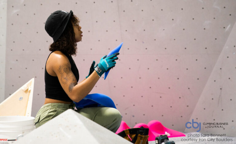 image of routesetter at iron city boulders