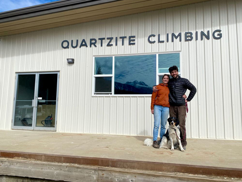 Patrick O'Neill and Leah Poirier standing in front of Quartzite Climbing Gym