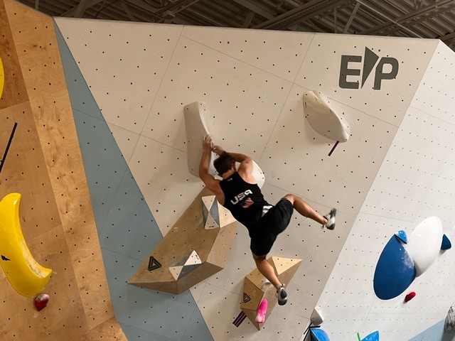 image of climbing on titan olympic wall